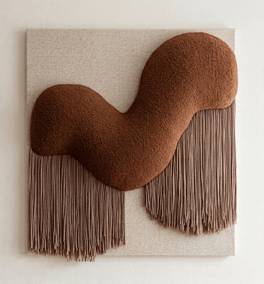 Brown abstract wall sculpture with fringes on a beige background