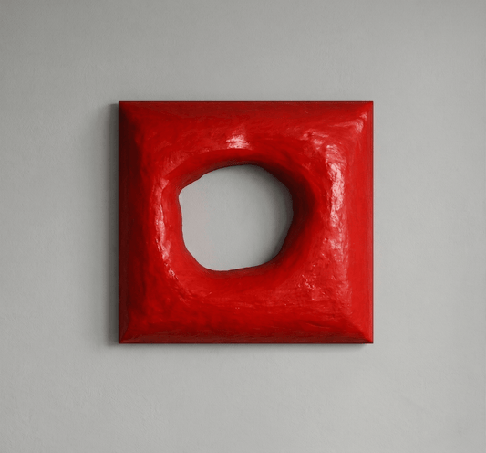 Red wall art on a grey wall background