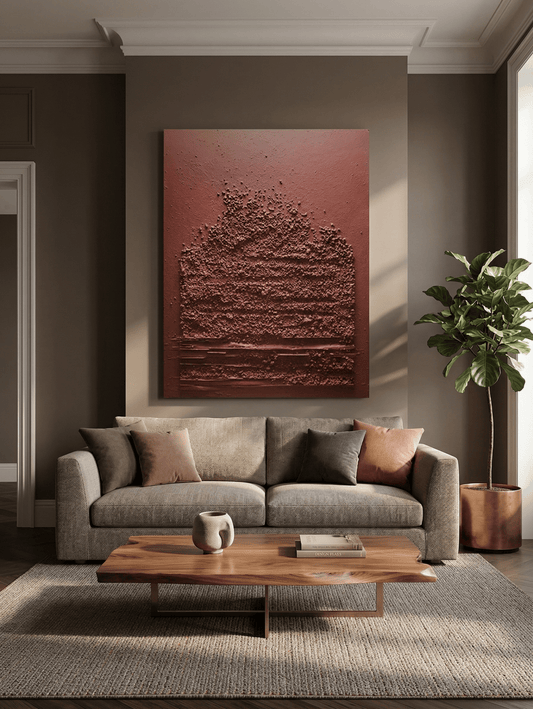 Modern living room with a textured wall art piece above a sofa.